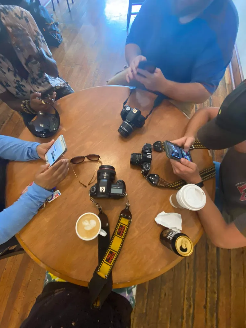 Cameras and coffee on a round table during mindfulness photography